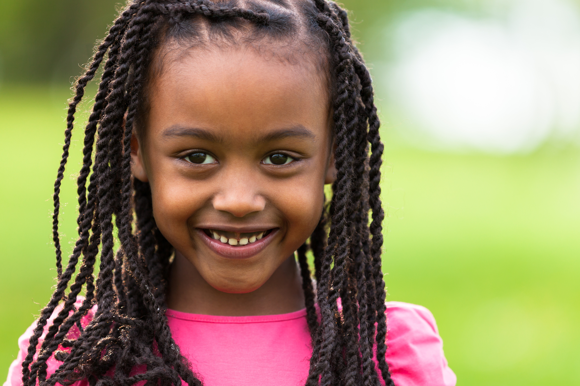 Close-Up Portrait Of A Cute Young Black Girl